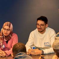 International Anchor Allies Winter 2026 First Mixer - crew member listening in